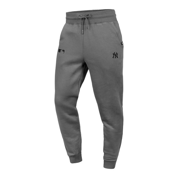 The model is wearing these MLB New York Yankees Base Runner ’47 Burnside Sweatpants in grey. 1