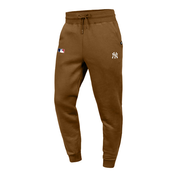 The model is wearing these MLB New York Yankees Base Runner ’47 Burnside Sweatpants in dark brown. 1