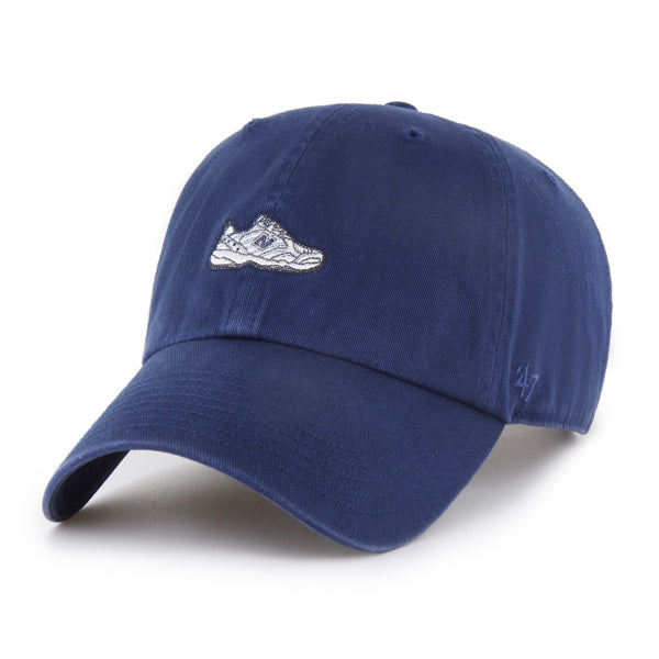Pictured is this New Balance Dad Shoe '47 CLEAN UP cap in navy. 1