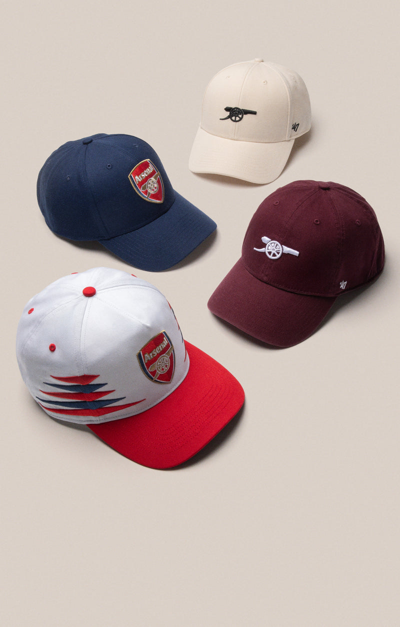 4 Arsenal hats, navy, cream, burgundy and white/red all featuring the arsenal logo or emblem 
