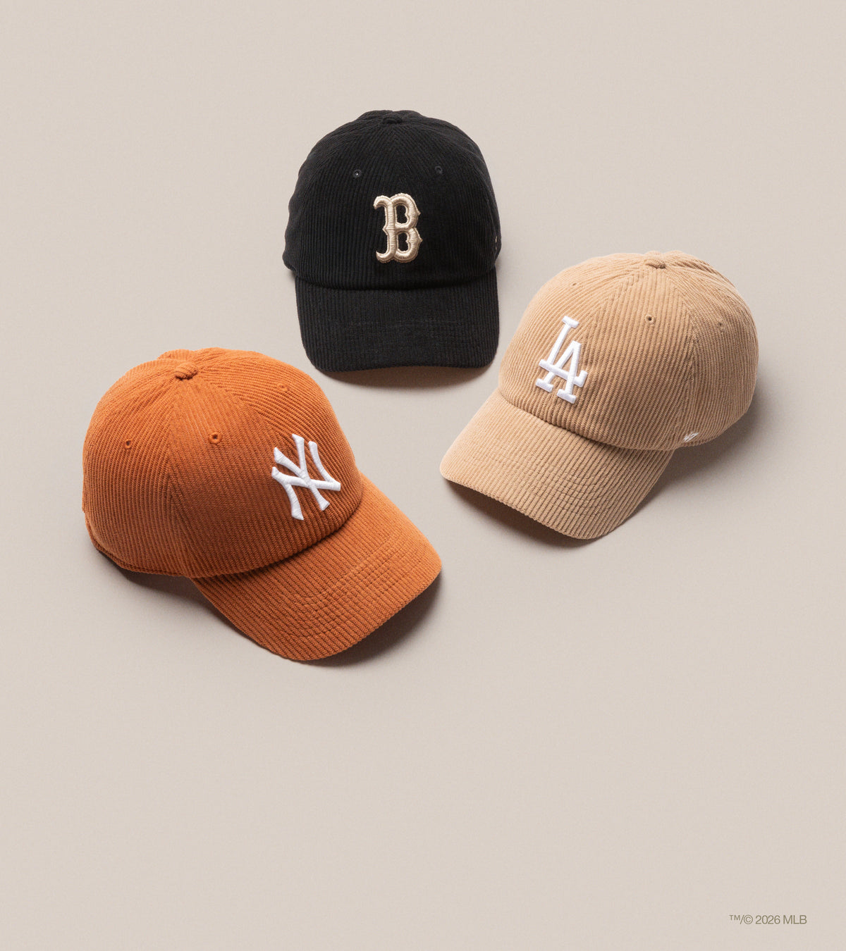 A black Boston Red Sox hat, brown Los Angeles Dodgers hat and orange New York Yankees hat all in corduroy material