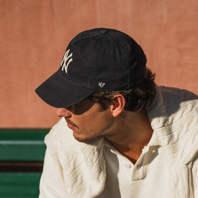 Man wearing a New York Yankees '47 navy cap.